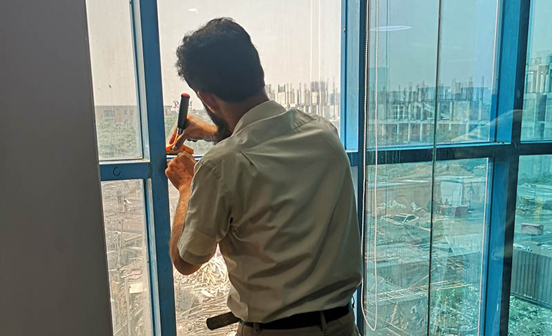 One of our installers cleaning the glass prior to an installation